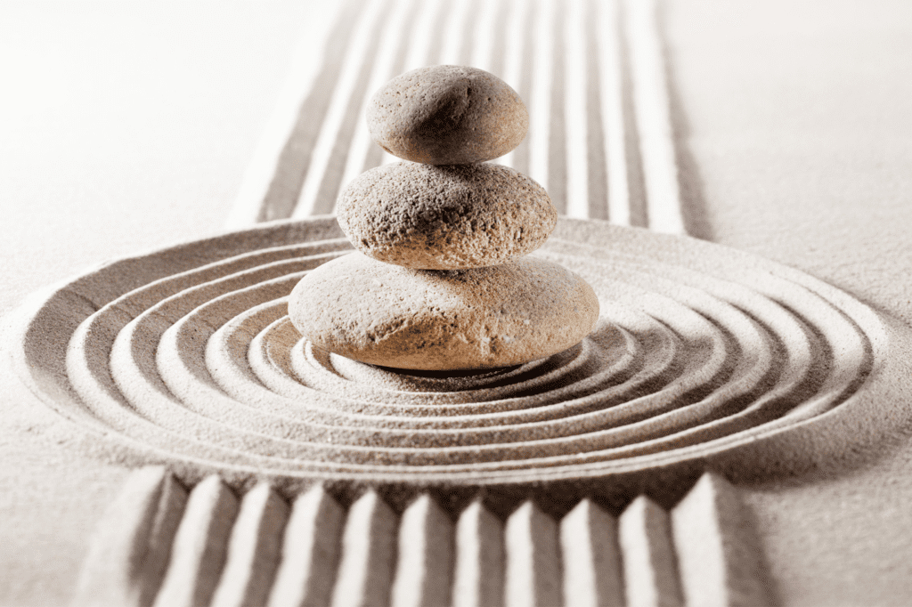 Meditation rocks stacked on tip of each other.