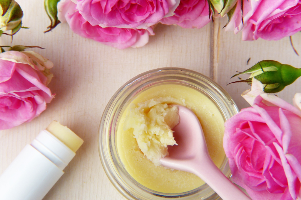 Self-care mask and Chapstick. It's surrounded by flowers