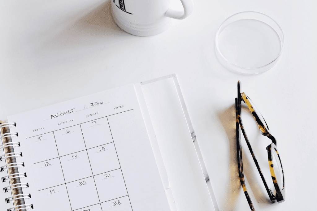 Calendar and glasses on a table